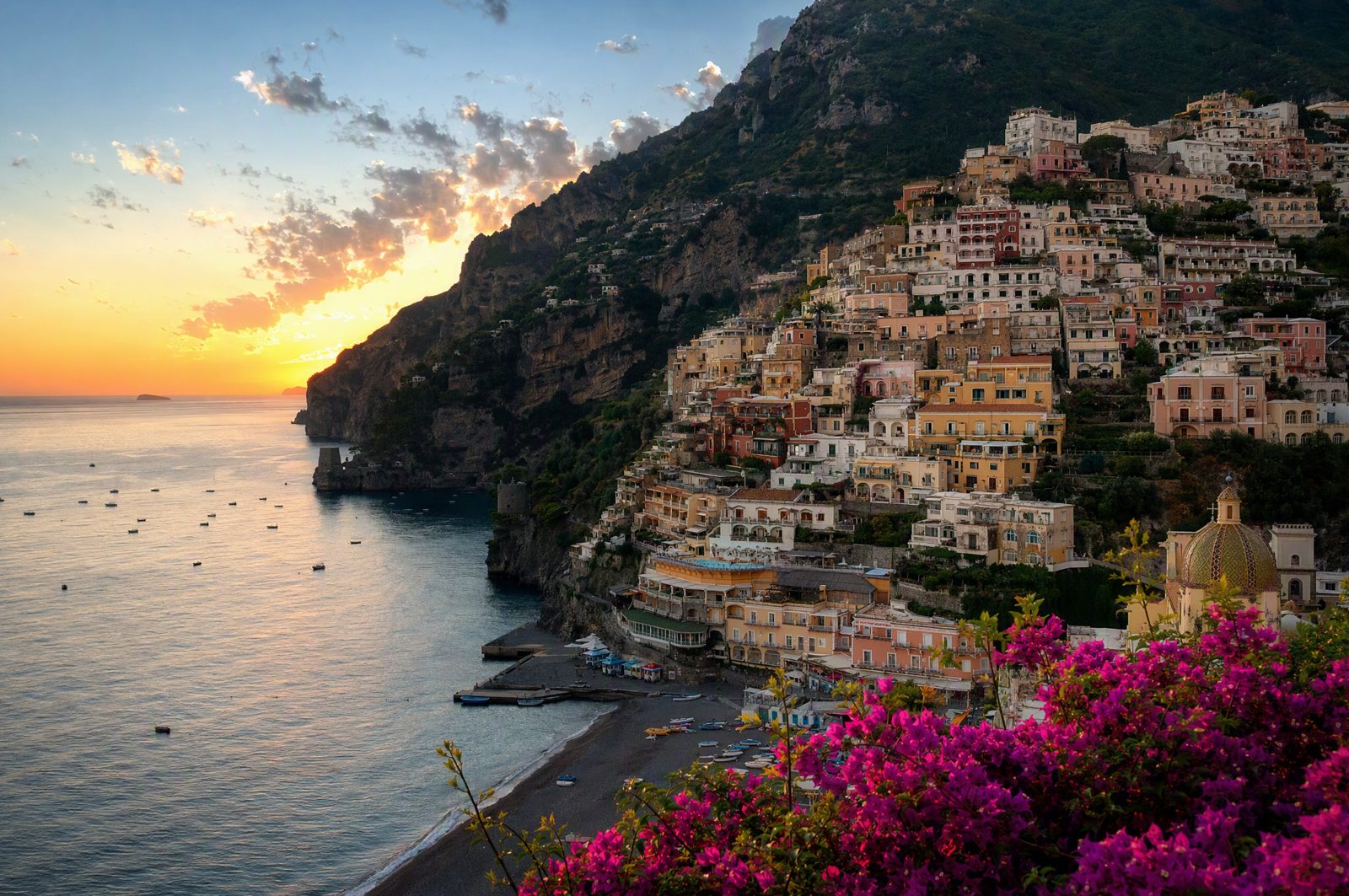 Positano at golden hour, the setting sun over the sea